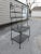 Vintage Large 4 Tier Black Wrought Iron Backers Rack. Nice large curvy display for indoors use or outdoors. Thick bold...