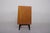 Small two-door sideboard in exotic wood (bubinga) on black lacquered beechwood compass legs. It opens with a free-form...