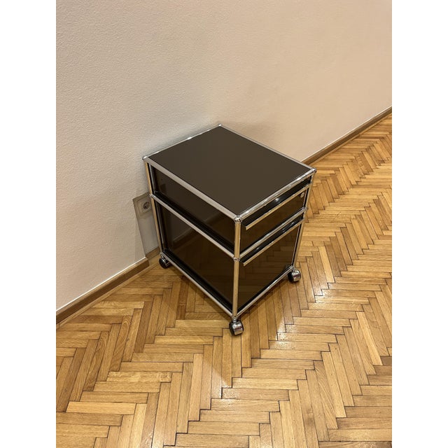 This usm haller mobile container is a refined example of the iconic swiss modular furniture system developed by architect...