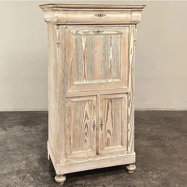 Handcrafted during the 19th century, this 19th Century French Louis Philippe Period Stripped Pine Secretary is ideal for...