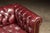 Wood Vintage Deep Red Leather Tufted Chesterfield Sofa With Brass Nailhead Trim For Sale - Image 7 of 9
