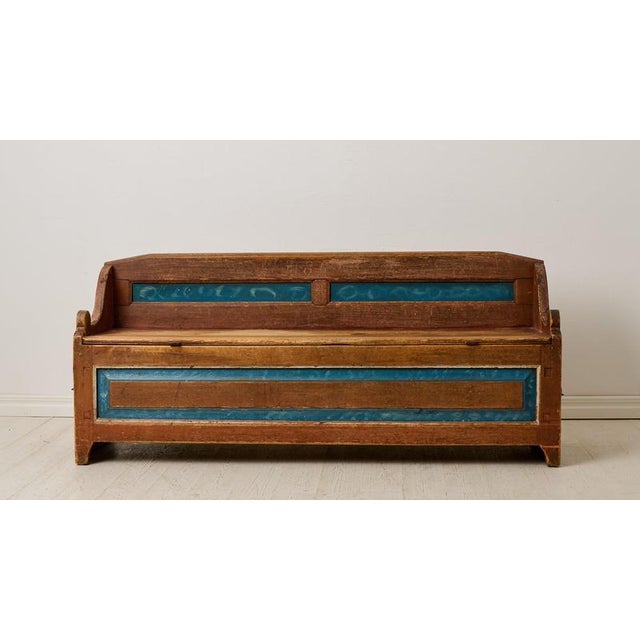 Genuine Swedish folk art bench or sofa from the mid 1800s. Made by hand in solid pine in Dalarna around 1860. There are...