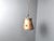 Vintage brutalist hammered copper sheet pendant light. The lamp emits a nice diffuse light thanks to the perforated shade....
