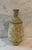 Rustic mid century artisan studio pottery tapered vase with a lava like textured finish in a modeled yellow, cream, green...