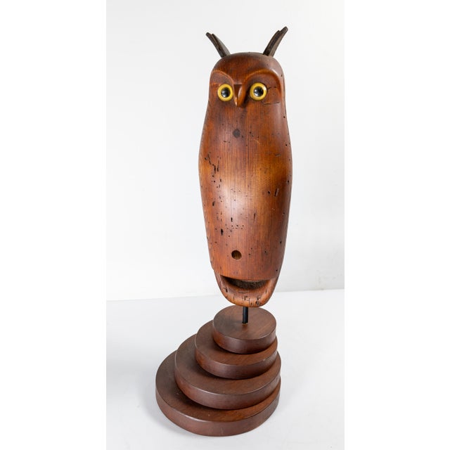 We are selling this great sculptural wooden Owl figure decoy. This figure is carved from wood with glass eyes and leather...