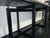 Large console table, warm olive green marble agglomerate top, matt black painted metal base. 250x65 cm, height 75 cm....