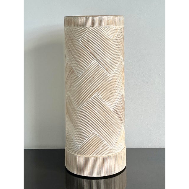 Introduce a layer of organic texture and geometric sophistication to your interior with this stunning vintage pencil reed...