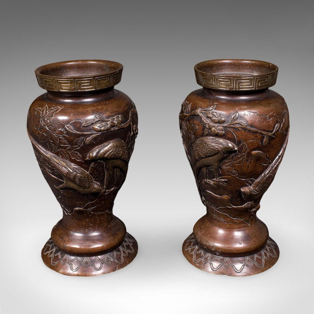 This is a pair of antique decorative Meiji vases. A Japanese, bronze baluster urn, dating to the mid Victorian period,...