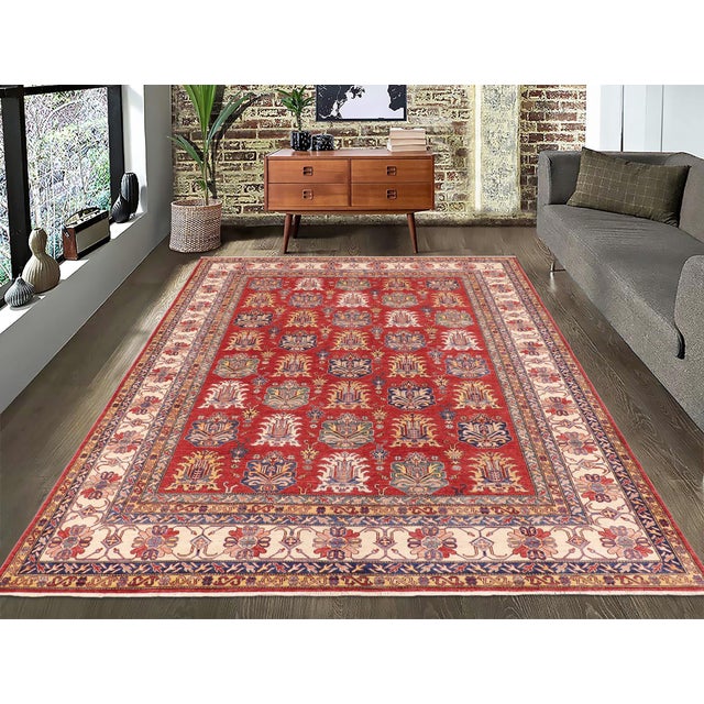 Enhance your home with this exquisite hand-knotted Super Kazak rug, crafted from fine hand-spun wool and dyed with all-...