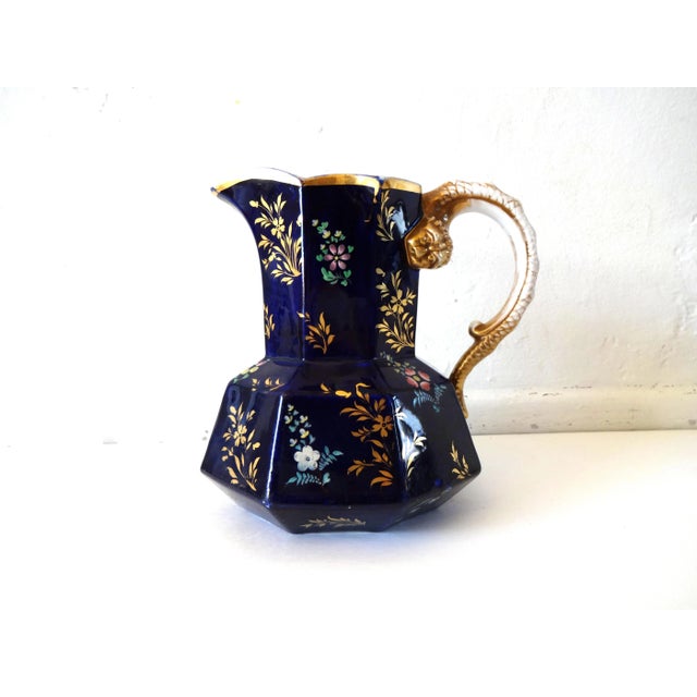An antique large English Staffordshire pitcher by Mason's, in their "Mazarine" cobalt blue with gilt and colorful enamel...