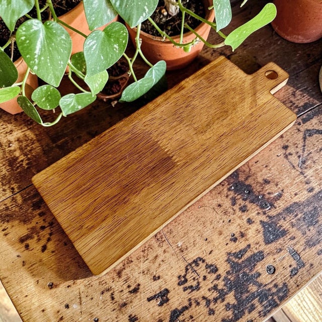 Elevate your entertaining experience with our Mini Wooden Charcuterie Board with Handle, designed in a chic MCM boho...
