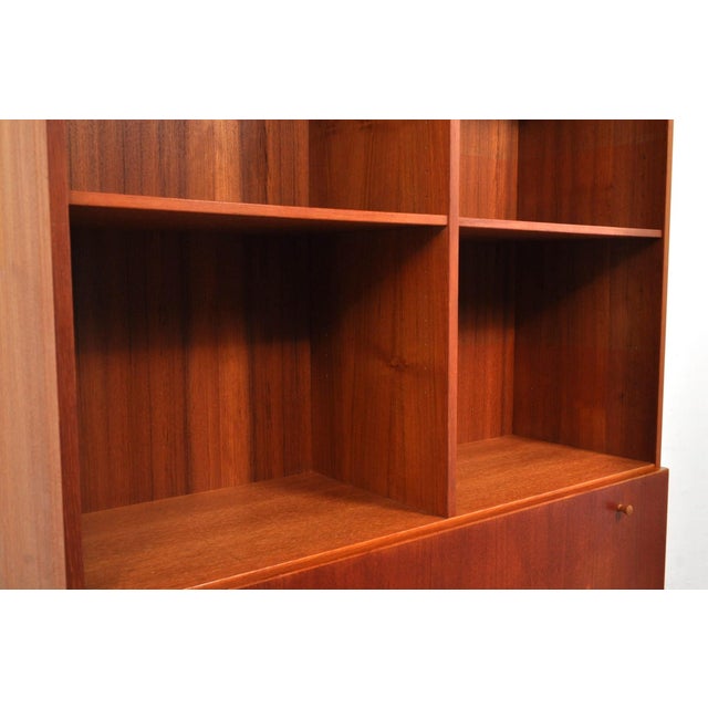 Nice mid-century modern cabinet. Sleek, practical, and beautiful. The shelves are height-adjustable. Behind the flap is a...