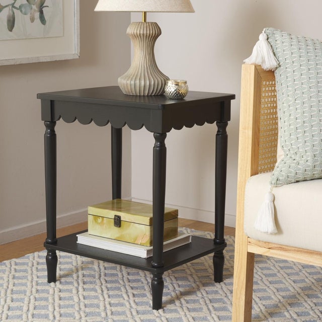 Enhance your space with the timeless beauty of the Haven Accent Table in a warm matt black finish. Its clean, modern...