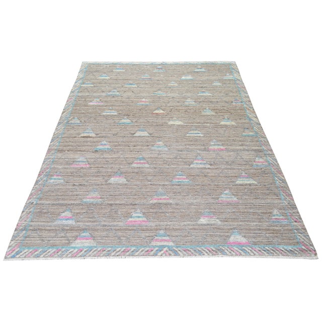 Hand-knotted with care using traditional rug making techniques, this wool rug blends timeless craftsmanship with a modern...
