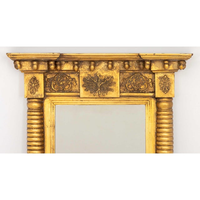 American Giltwood Framed Mirror, with two mirror plates flanked by columnar supports. Overall: 37.5" H x 23.25" W x 4.25"...