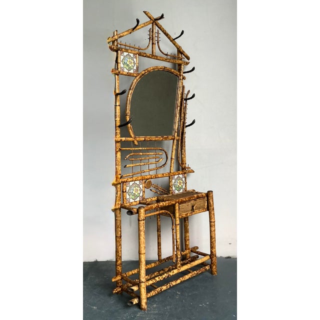 Make a grand statement in your entryway or dressing area with this captivating vintage bamboo hall tree, exuding a...