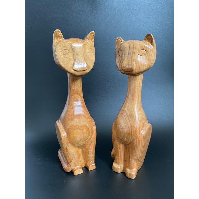 A lovely pair of hand carved wooden cat by local artist E. Hummel, crafted in the 90s. The duo combines the clean Mid-...