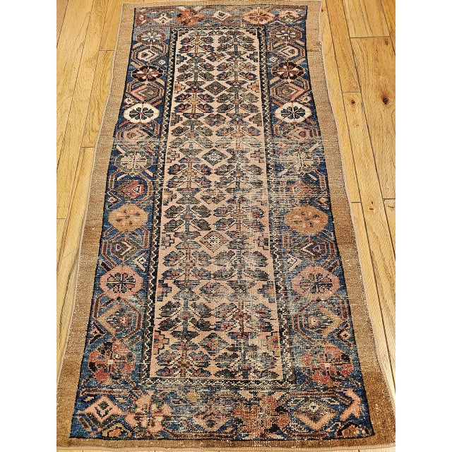 "This exquisite antique Persian Malayer rug from the early 1900s features an exceptionally desirable allover geometric...