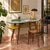 Italian 1950s desk characterized by distinctive design and functional structure. The double formica top, one blue and the...