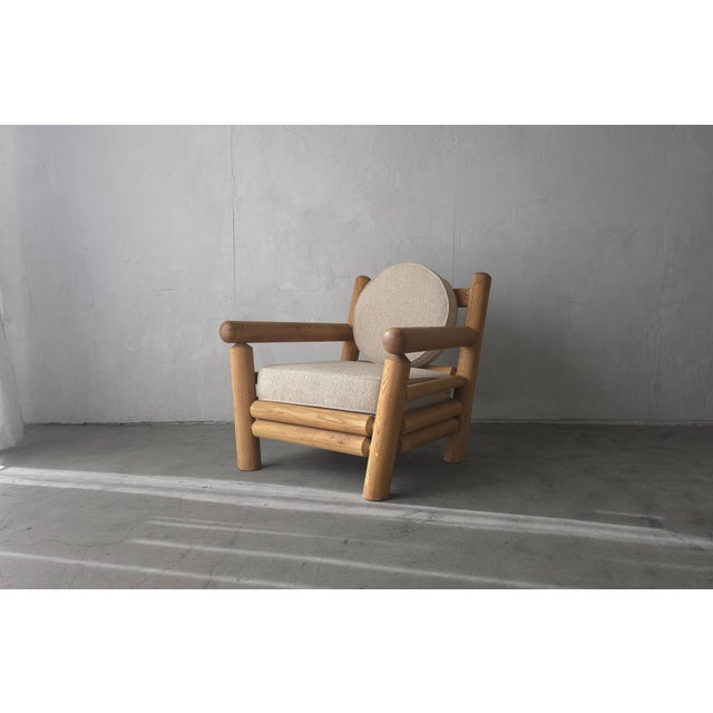 Superb oversized, oak post lounge chair. A vintage masterpiece design that we have modernized with a natural finish and...