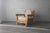 Superb oversized, oak post lounge chair. A vintage masterpiece design that we have modernized with a natural finish and...