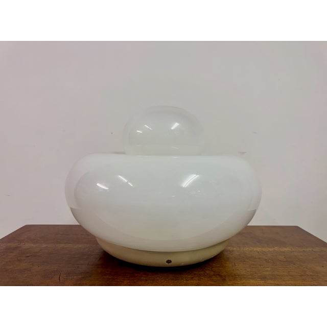 A sculptural table lamp designed by Giuliana Gramigna for Artemide, Italy, circa 1960s–1970s. The lamp features a striking...