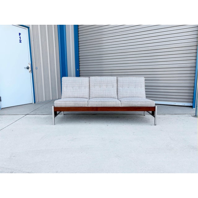 ✨ Mid-Century Modern Walnut & Aluminum Sofa ✨ This beautifully mid-century modern sofa is a striking blend of warm natural...