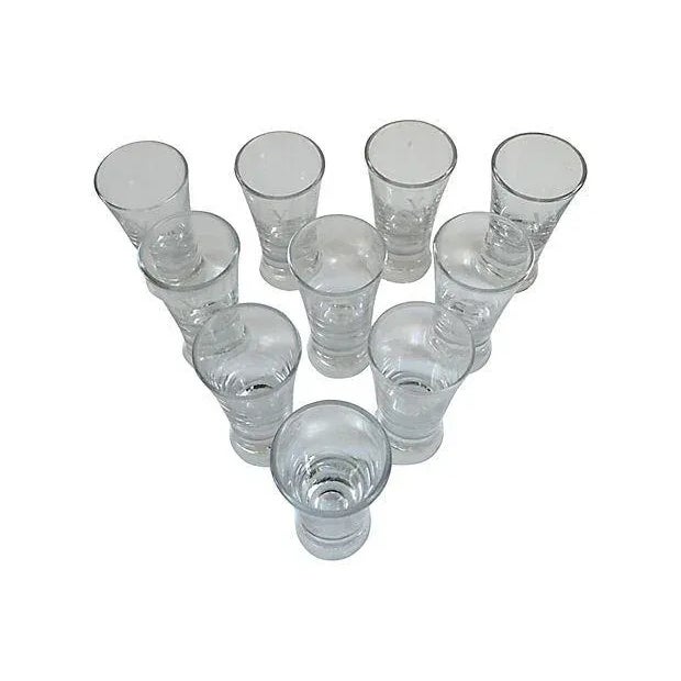 Vintage set of ten "V" monogram shot glasses. No maker's mark. Condition: Excellent Dims: 1.65" Dia x 3.35" H