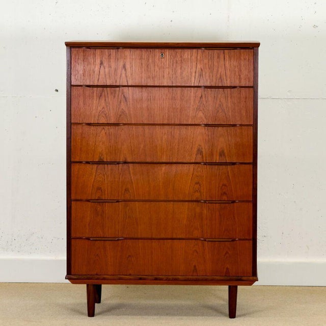 Beautifully handcrafted in Denmark during the 1960s, this elegant Mid-Century tall chest of drawers embodies the timeless...