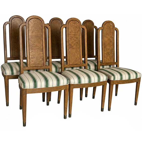 These chairs feel architectural, sophisticated, and statement-making. The dramatic backs instantly draw the eye, while the...