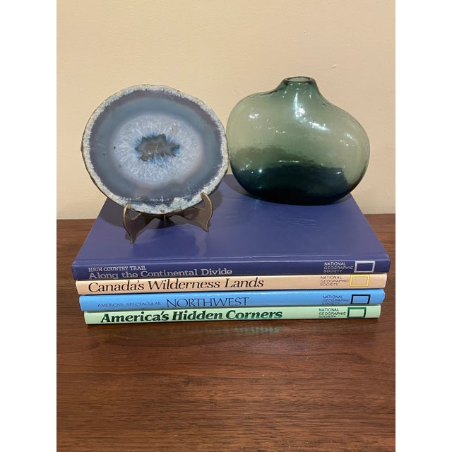 Colorful set of 1980s vintage nature photography books from National Geographic. These books not only depict the...