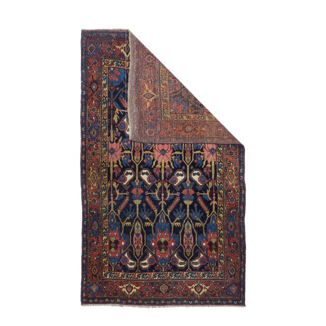 This extremely solid and robust, well-woven Kurdish city scatter presents a navy field with a cartouche lattice enclosing...