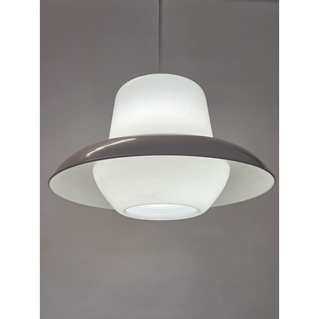 Ceiling lamp made by Itsu, model AA 12. Made of glass and metal. The lamp is in good used condition and the electricity...