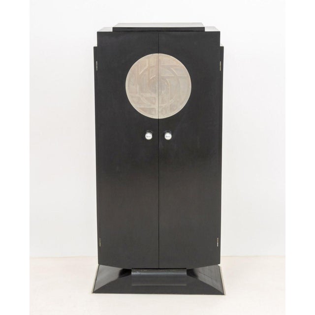 Art Deco Black Lacquered and Chrome Cabinet, the two doors opening to five shelves. 52" H x 26.5" W x 15.75" D....