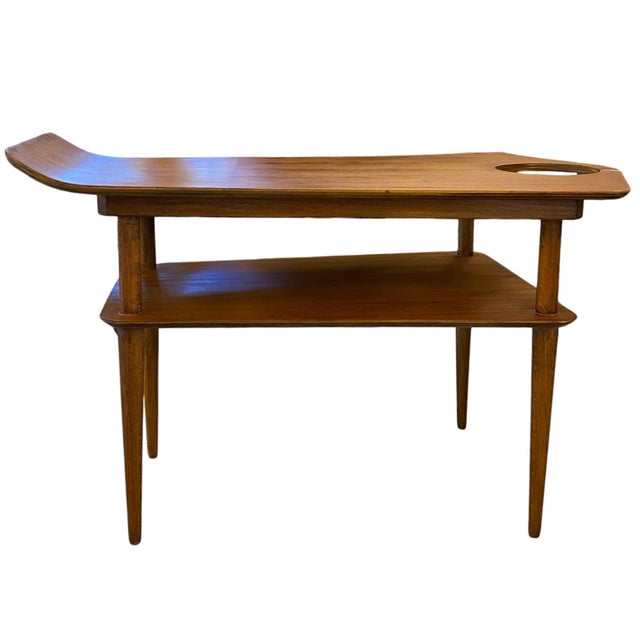 Coffee table made of walnut veneer with an original design inspired by a ski or sled. It was designed by Ewart Myer for...