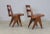 A set of 10 French, teak dining chairs, 1960’s. In the style of Pierre Jeanneret. The chairs have slightly angled, slatted...