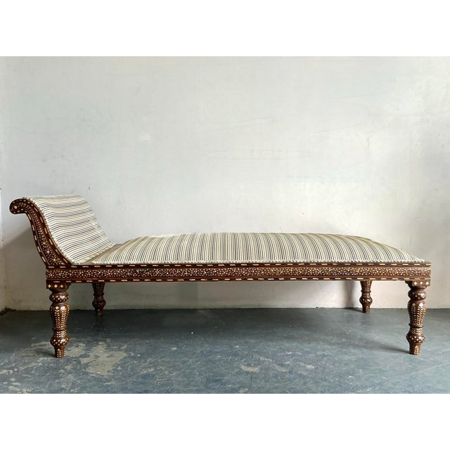 Indulge in the exotic charm and relaxed elegance of this vintage Boho Chic chaise lounge, a truly distinctive piece that...