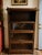 An elegant early twentieth-century oak barrister bookcase featuring four glass-front stacking sections and beautifully...