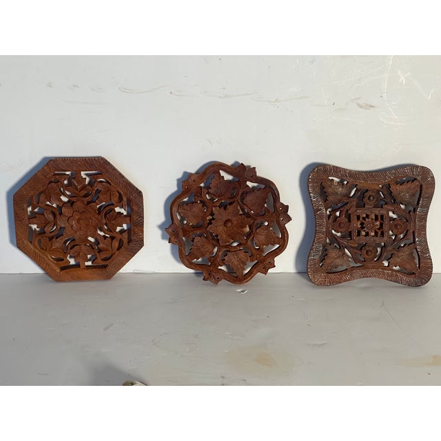 Set of 3 vintage handcarved wood trivets or wall dedorative plates.