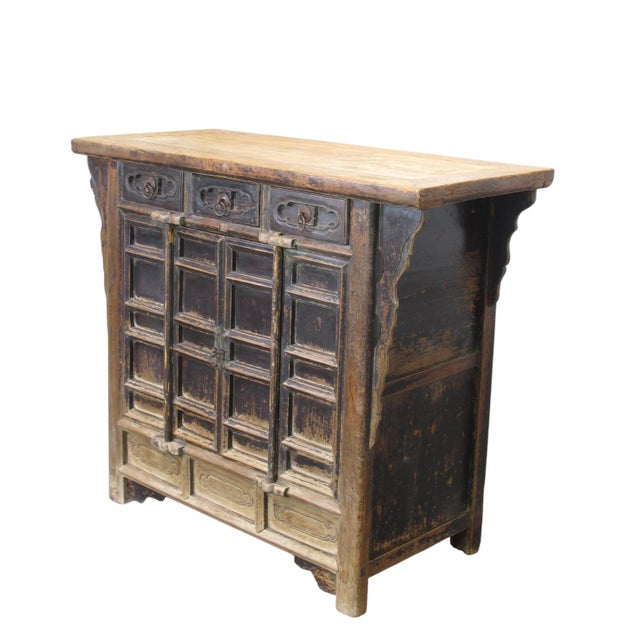 Retrieved from Shanxi Province in Northern China, this beautifully aged 17th century cabinet is made from solid elm using...