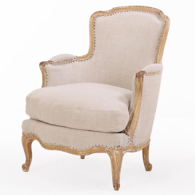Each chair features a finely carved and painted wood frame with gracefully shaped arms, upholstered back, and generous...