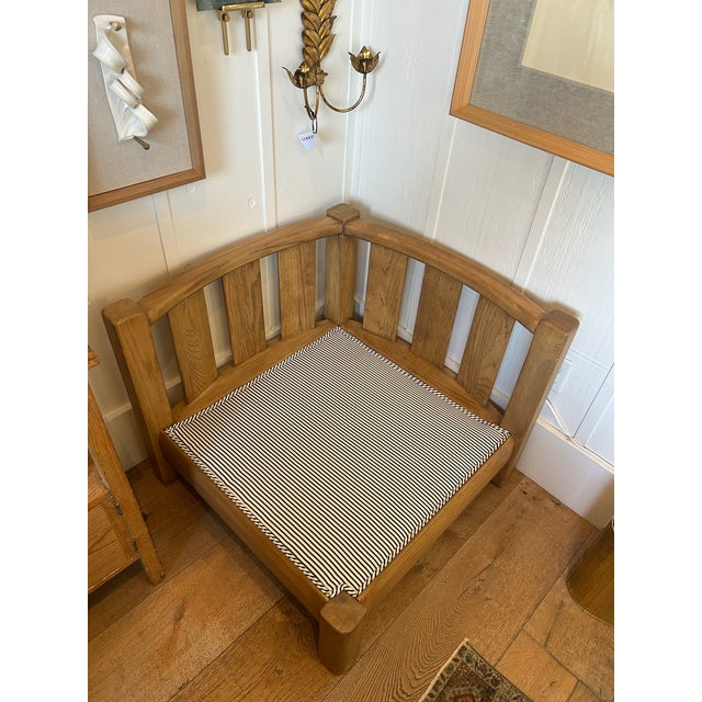 Vintage corner lounge chair with solid oak frame and vertical slat back design. Newly upholstered seat and back cushions...