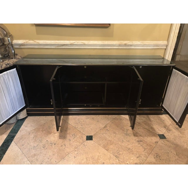Bring timeless elegance and refined craftsmanship to your home with this stunning vintage Chinoiserie buffet. Finished in...