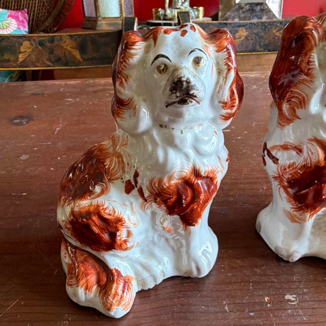 A Charming Pair of Antique Staffordshire Spaniel Dogs, Circa 1880 Made in Staffordshire, England, circa 1860-1880 A small,...