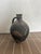 This vintage Turkish stoneware vessel embodies centuries of craftsmanship, showcasing both functionality and artistry...