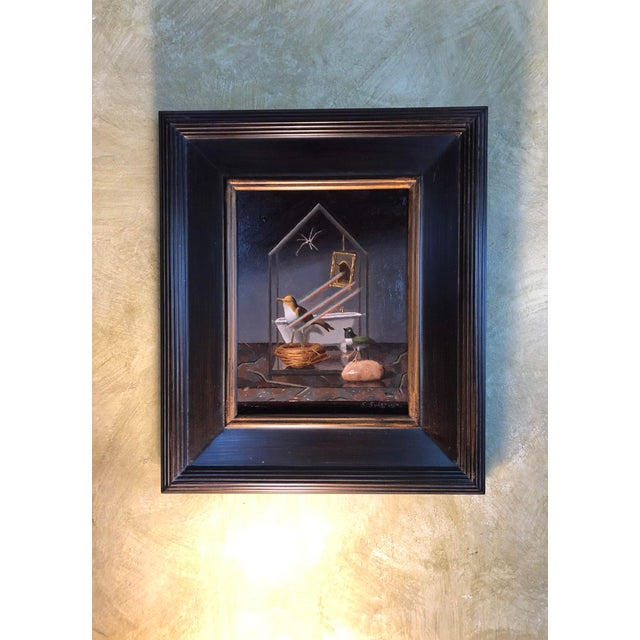This oil painting depicts a delicate glass house containing two birds, one perched beside a nest and the other on a stone....