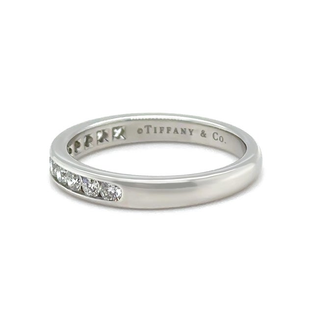 A timeless Tiffany & Co. diamond wedding band crafted in platinum, featuring a refined row of round brilliant cut diamonds...