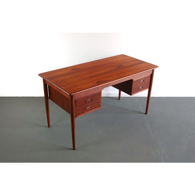 Gorgeous Desk, with some of the best lines in its class. Simple and timeless. Brass accents upholding the drawers and a...