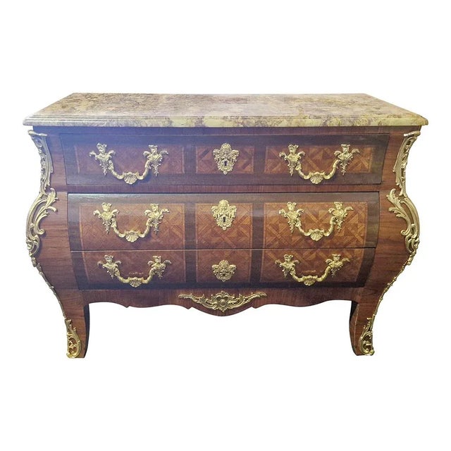 French chest of drawers with wavy front and sides, three drawers and a top in Breche marble. Reserves inlaid with...