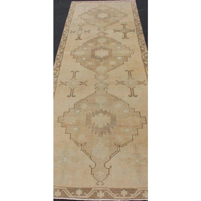 Mid 20th Century Vintage Turkish Oushak Runner Neutral and Warm Colors With Tribal Medallions For Sale - Image 5 of 13